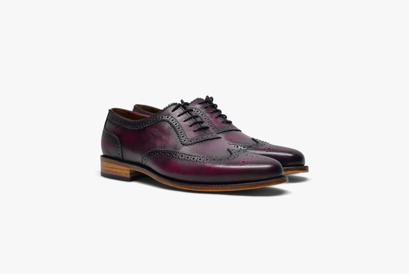 Oxford brogue shoe in oxblood color. Hand made leather shoe.