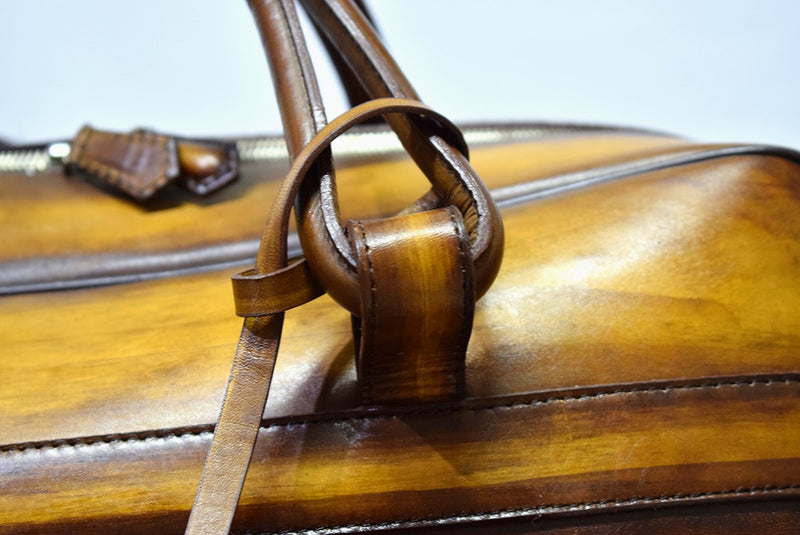 Close view of Leather Bolan Weekender Bag in Yellow